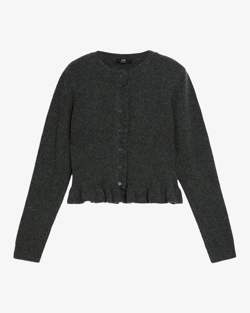 Long-sleeved grey frilly button-up cardigan.