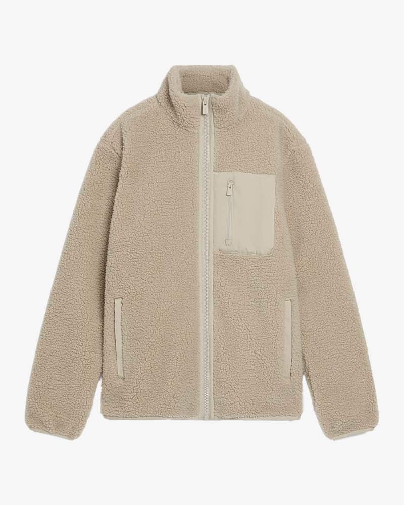 Cream borg fleece with front pocket and zip-up front.