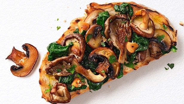 Crunchy toast topped with mushrooms, spinach and a kick of garlic flavour