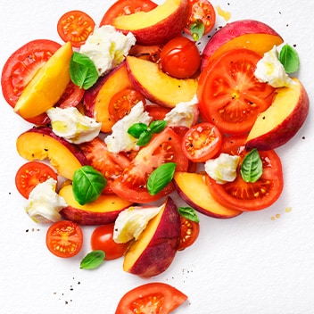 Enjoy a light lunch with fresh tomatoes, peaches and Finest burrata, all in one dish
