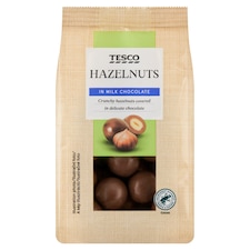 Tesco Pražené jadrá lieskových orechov v mliečnej čokoláde 120 g