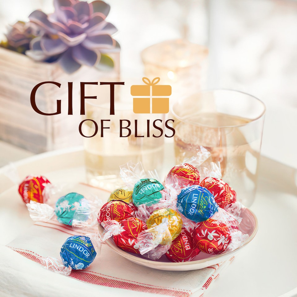 image 1 of Lindt Milk Chocolate Egg With Assorted Truffles 348G