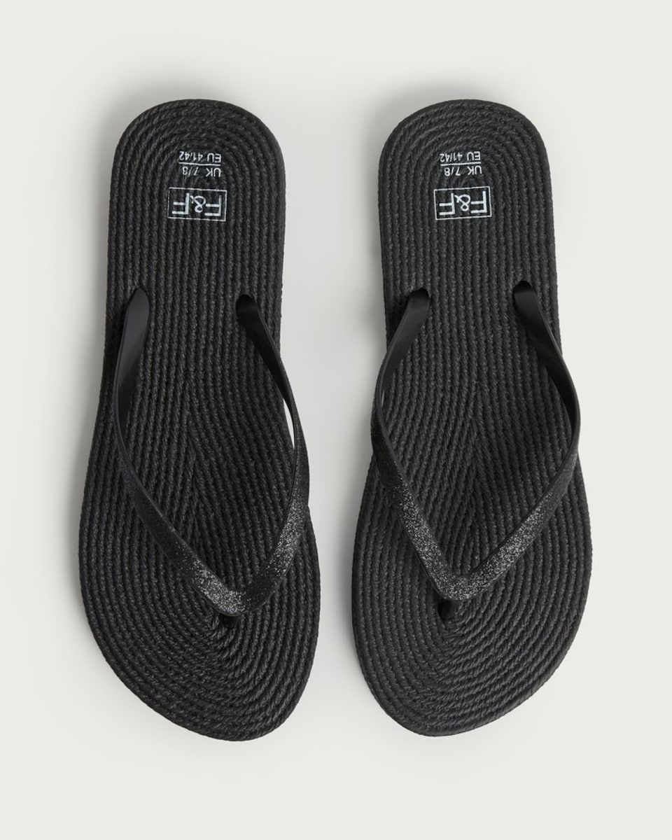 image 1 of F&F Glitter Strap Flip Flops in Black