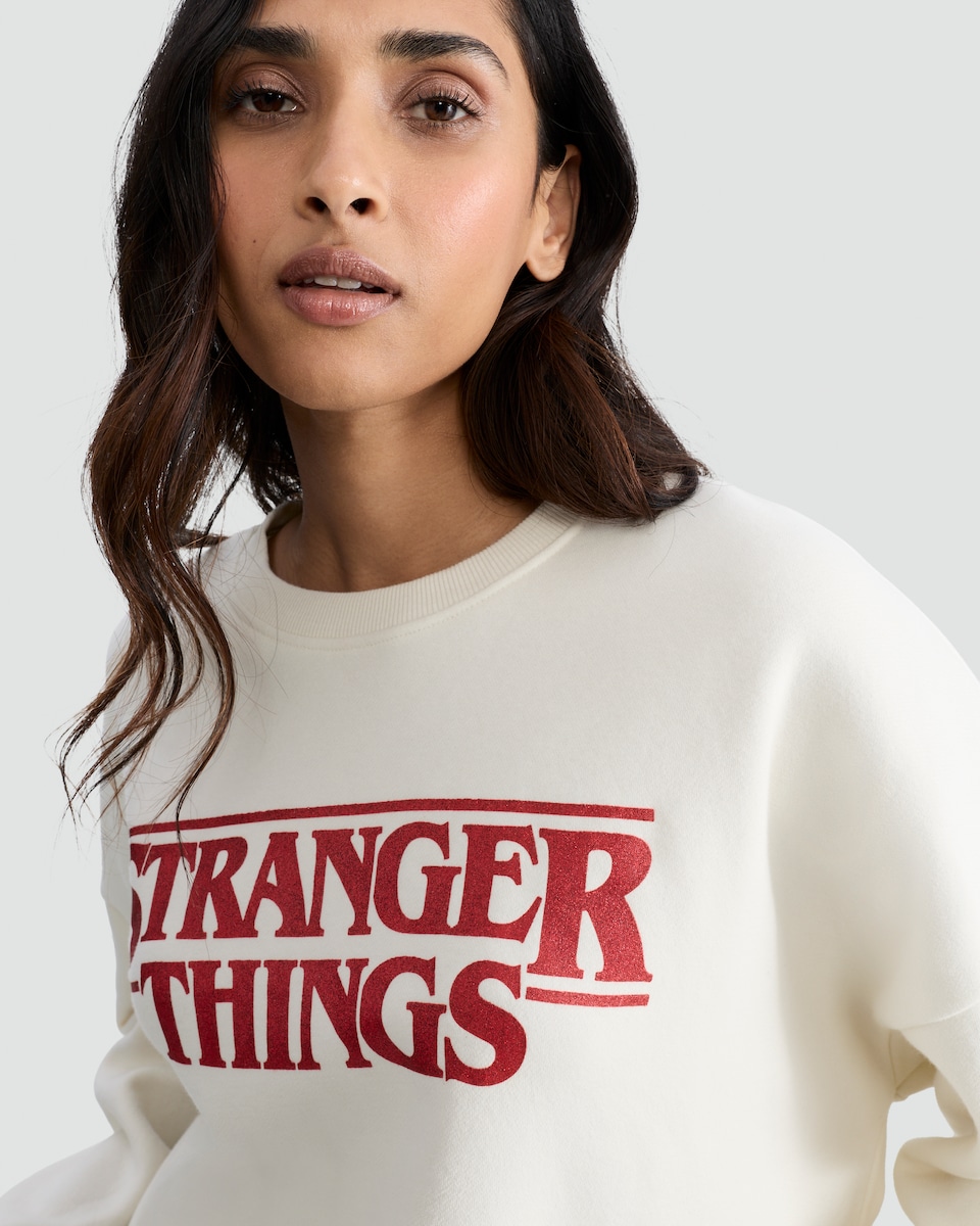 image 1 of Stranger Things Cotton Rich Slogan Sweatshirt in Cream