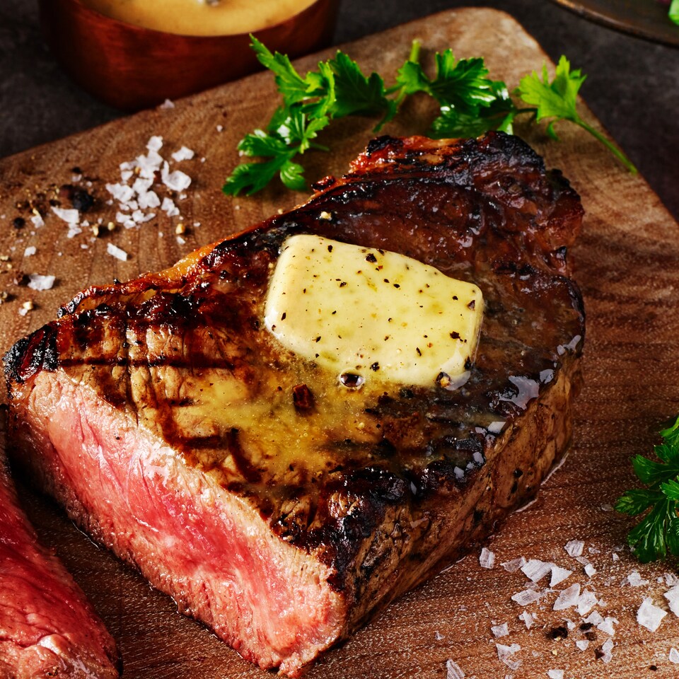 image 1 of Tesco Finest Butter with Truffle Flavoured Olive Oil, Black Pepper, Garlic & Onion 90g