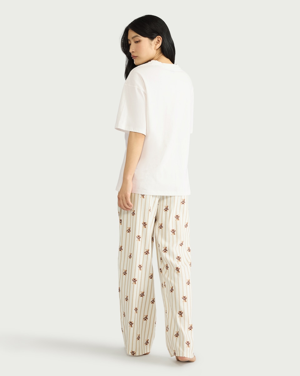 image 1 of F&F Cotton Blend NYC Bear Print Pyjama Set in Cream