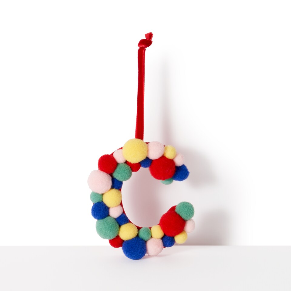 image 1 of Paperchase Cosmic Christmas Pom Pom Letter C Hanging Decoration