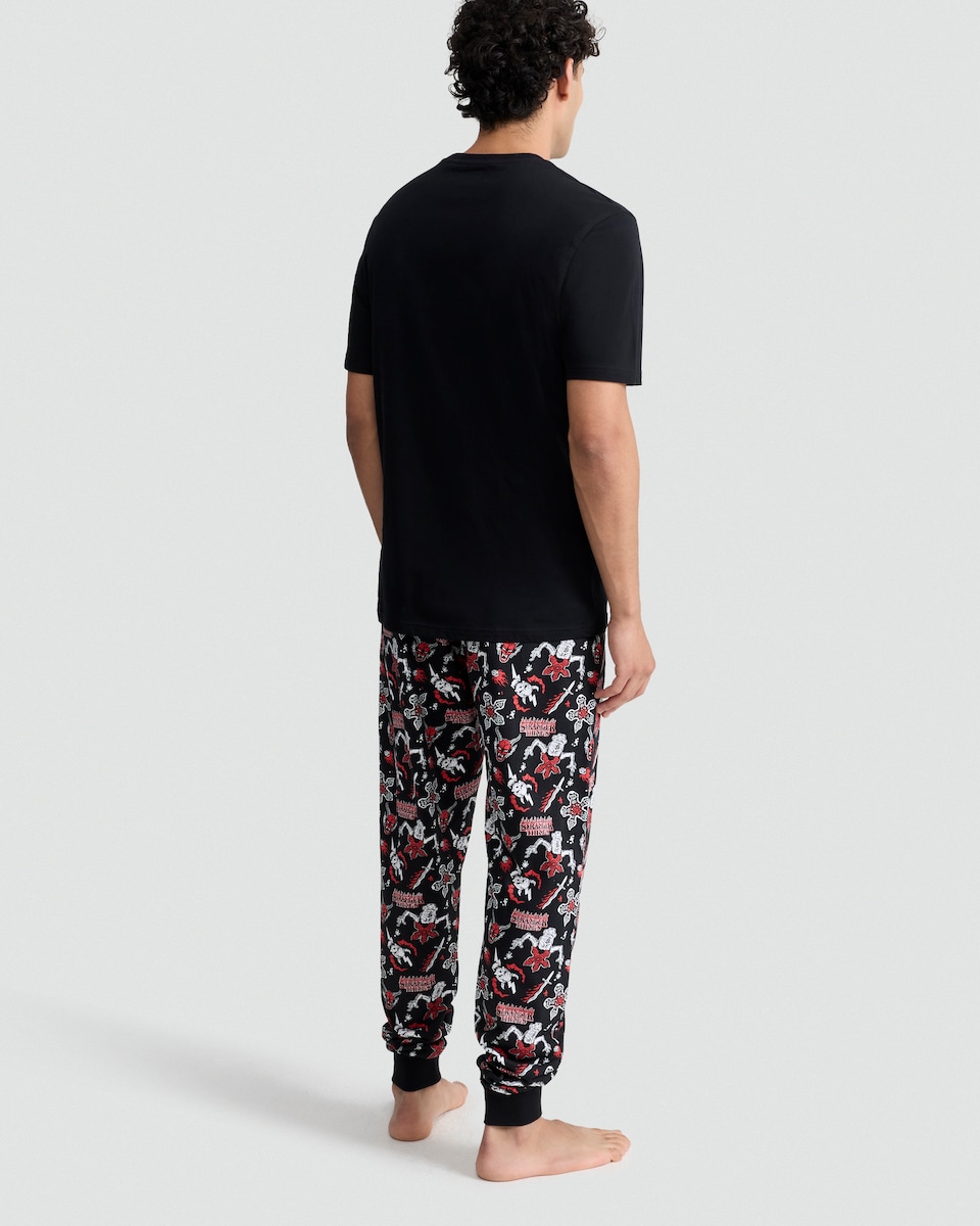 image 1 of F&F Pure Cotton Stranger Things T-Shirt and Cuffed Joggers Pyjamas Set in Black