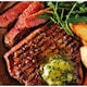image 2 of Tesco Finest Dine In 30 Day Matured British Ranch Steaks With Wild Garlic Butter 323G
