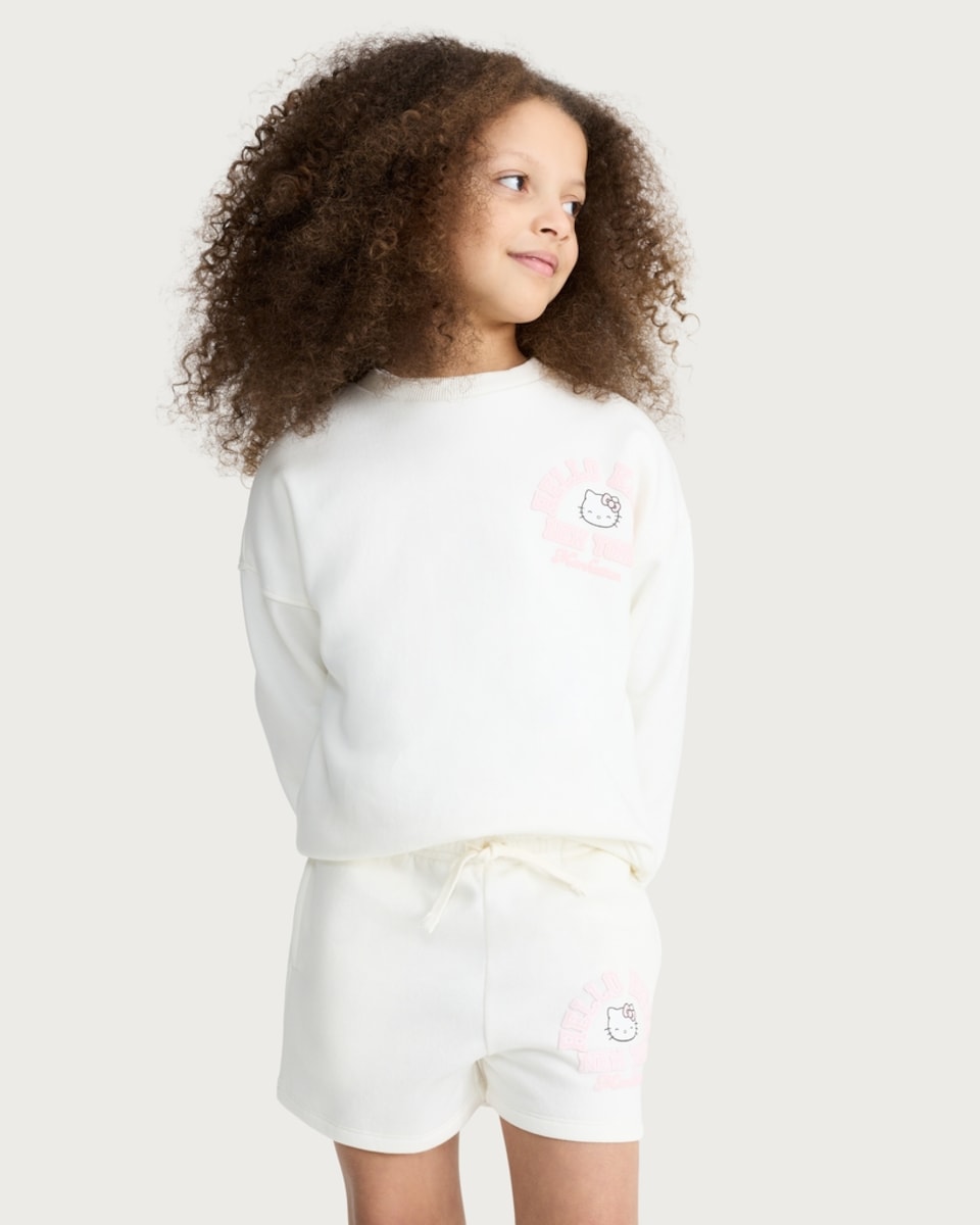 image 1 of Hello Kitty Cotton Rich New York Print Sweatshirt in Cream