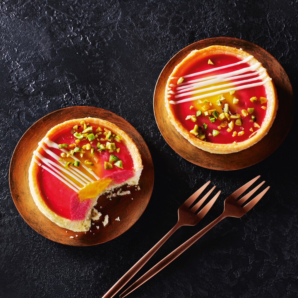 image 1 of Tesco Finest Zingy Raspberry, Passion Fruit and Pistachio Tarts 160g