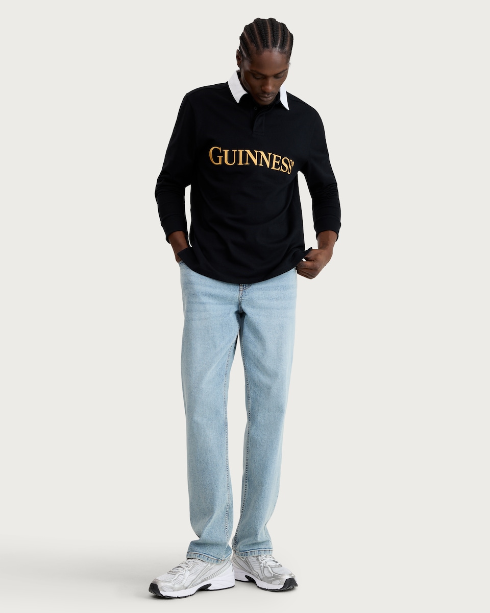 image 1 of Guinness Pure Cotton Embroidered Slogan Long Sleeved Rugby Shirt in Black