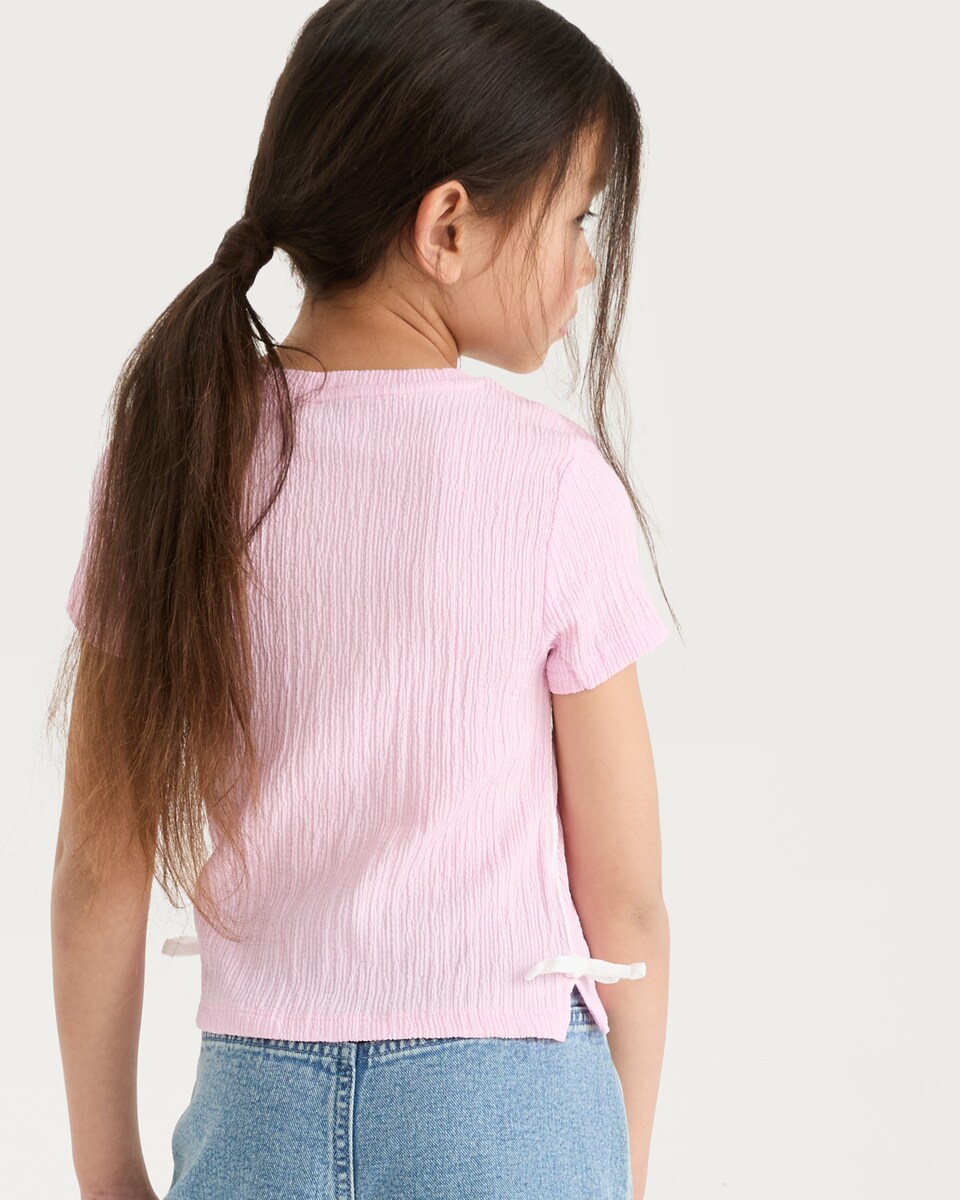 image 1 of F&F Girls Textured Bow Side T-Shirt in Pink