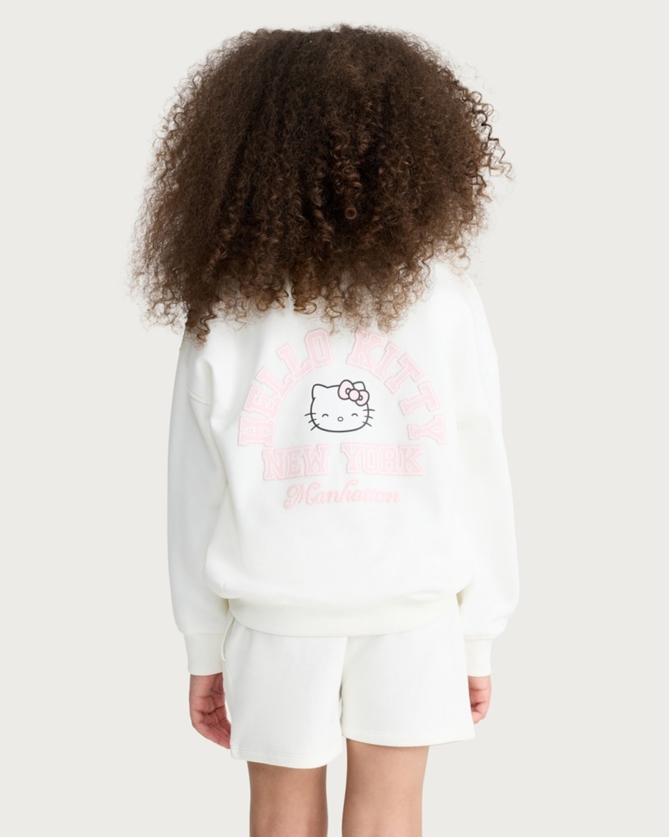 image 1 of Hello Kitty Cotton Rich New York Print Sweatshirt in Cream