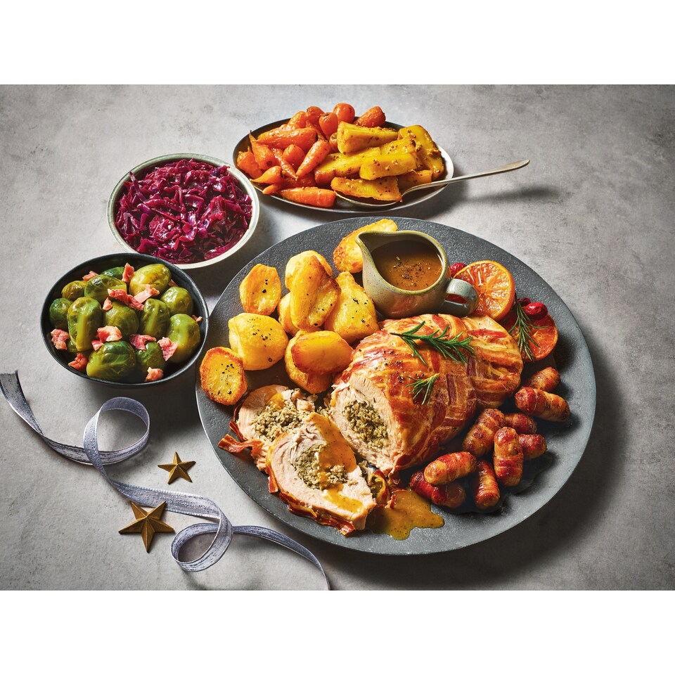 image 1 of 35. Tesco Finest Slow Cooked Turkey with all the Trimmings 3.48kg (Serves 4)