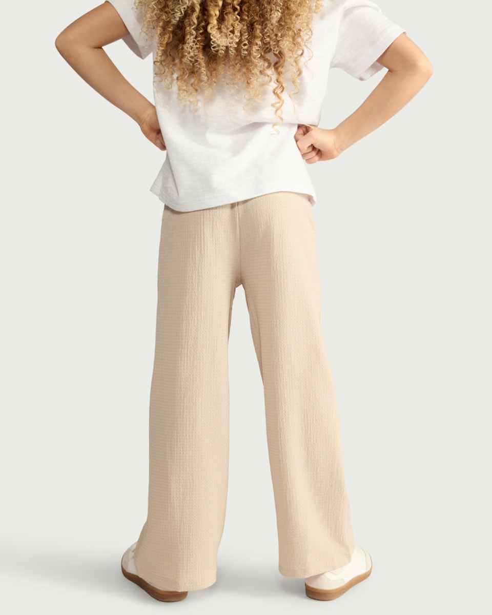 image 1 of F&F Girls Crinkle Textured Wide Leg Drawstring Trousers in Neutral