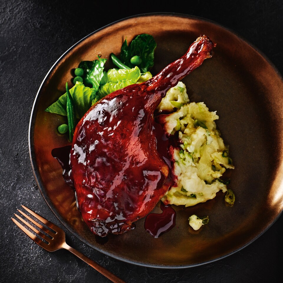 image 1 of Tesco Finest Slow Cooked Duck Legs with a Port and Berry Sauce 505g