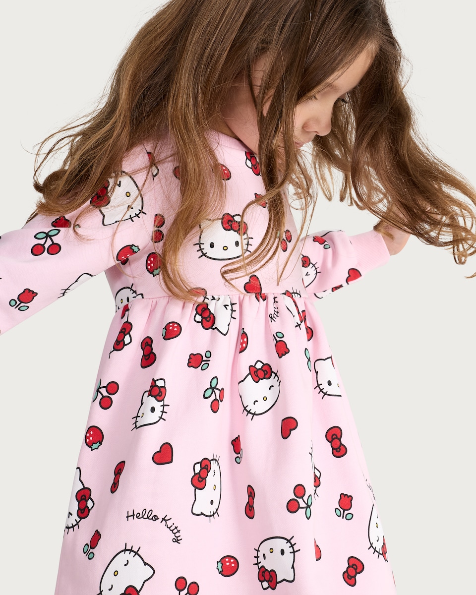 image 1 of Hello Kitty Print Cotton Rich Long Sleeved Sweatdress in Hot Pink