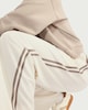 image 1 of F&F Active AFTERCLASS Side Stripe Wide Leg Joggers in Cream