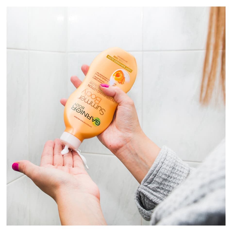 image 1 of Garnier Body Light Gradual Tan Moisturiser 400Ml