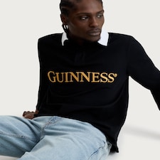 Guinness Pure Cotton Embroidered Slogan Long Sleeved Rugby Shirt in Black
