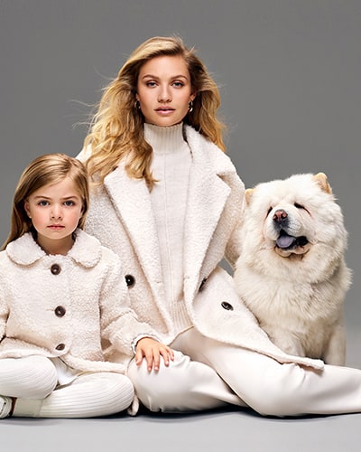 Women's white, double breasted knitted coat with dark buttons