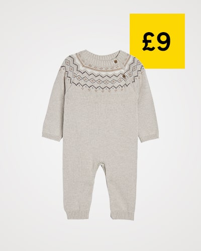 Sleepsuit is light beige with Fair Isle detail