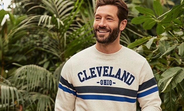  Cream jumper with 'Cleveland' in block black text with blue outline across the chest. Single thick black stripe and blue stripe across the chest and sleeve
