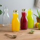 image 5 of Bormioli Rocco Quattro Stagioni Glass Juice Bottles with Screw Top Lid - 1L - Pack of 3 Clear | One Size