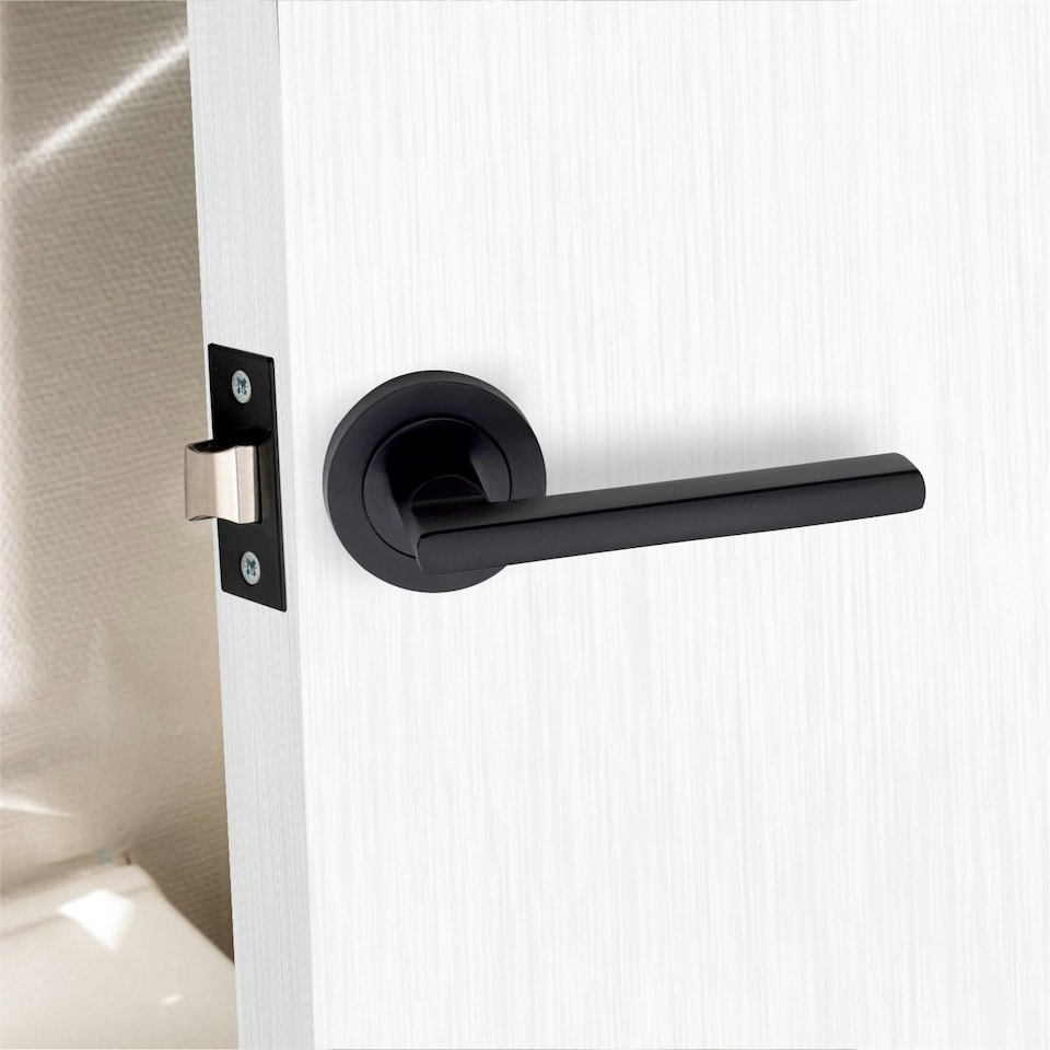 image 1 of Golden Grace Leon Design Door Handles Set on Round Rose in Matt Black Finish with 64mm 3 Lever Mortise Lock and Key Hole Black