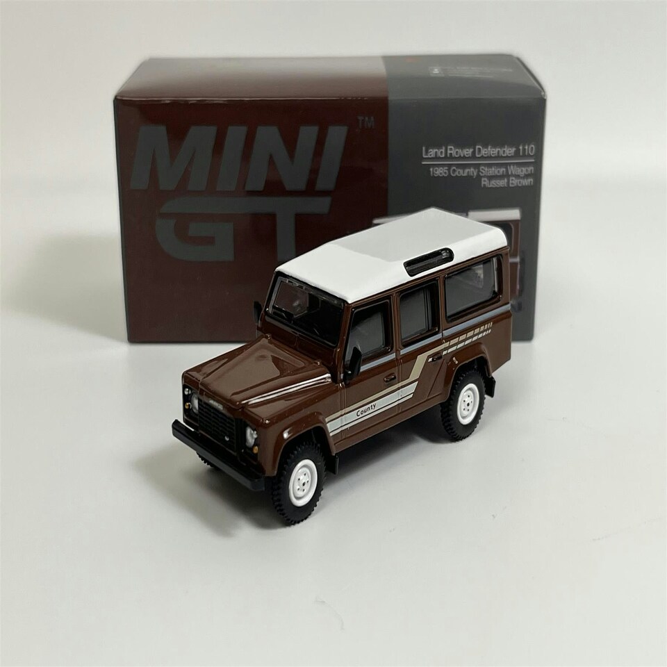 image 1 of Land Rover Defender 110 1985 County Station Wagon Russet Brown LHD 1:64 Mini GT MGT00734L