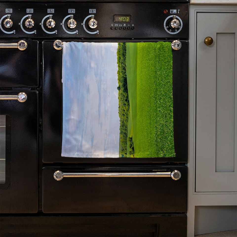 image 1 of Summer landscape with hilly green field and forest in the distance (Kitchen Towel)