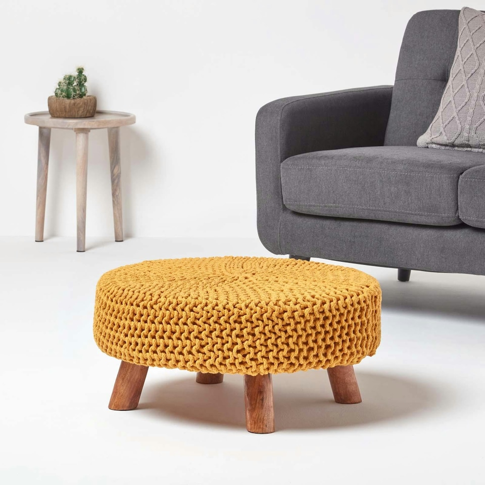 image 1 of Homescapes Mustard Large Round Cotton Knitted Footstool on Legs | Yellow | 62 x 62 x 30 cm