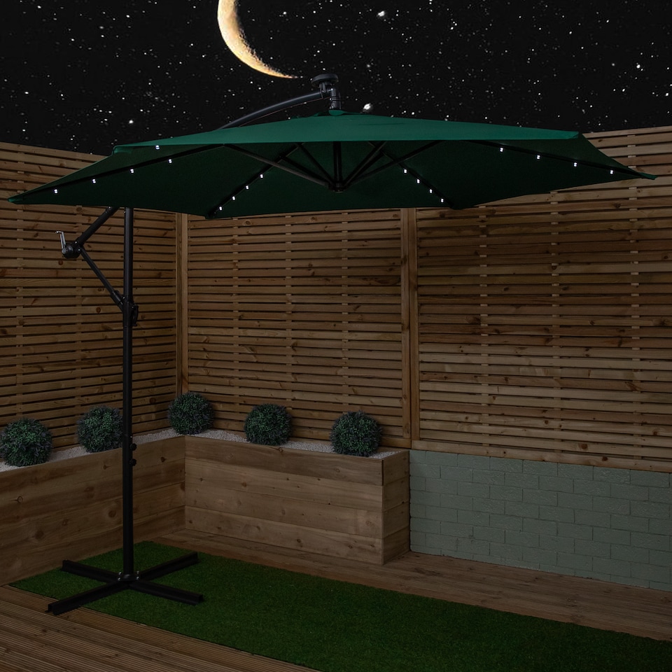 image 1 of Samuel Alexander 3m Solar Powered Cantilever Lit Banana Garden Parasol with Crank Handle & White LED Lights in Green