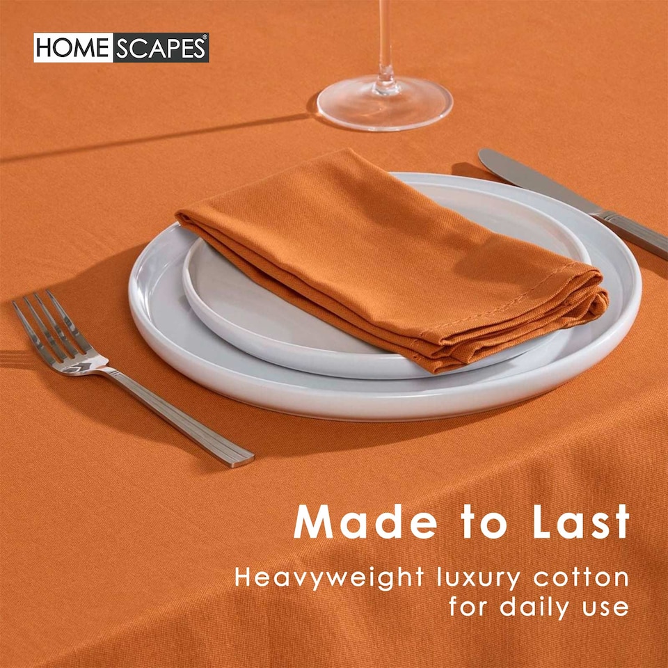 image 1 of Homescapes Burnt Orange Cotton Tablecloth - 137 x 178 cm | Orange | 137cm x 178cm (54" x 70")