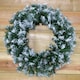 image 4 of 55cm Premier Christmas Snow Tipped Green Pine PVC Door Wreath