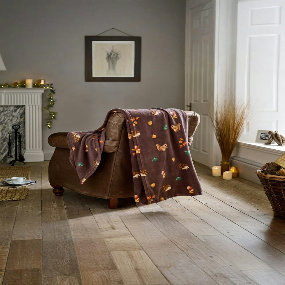 image 1 of Hogging It Throw – Wine Coloured Blanket Featuring Hedgehogs, Squirrels & Woodland Charm 140x180cm Multi | Wine