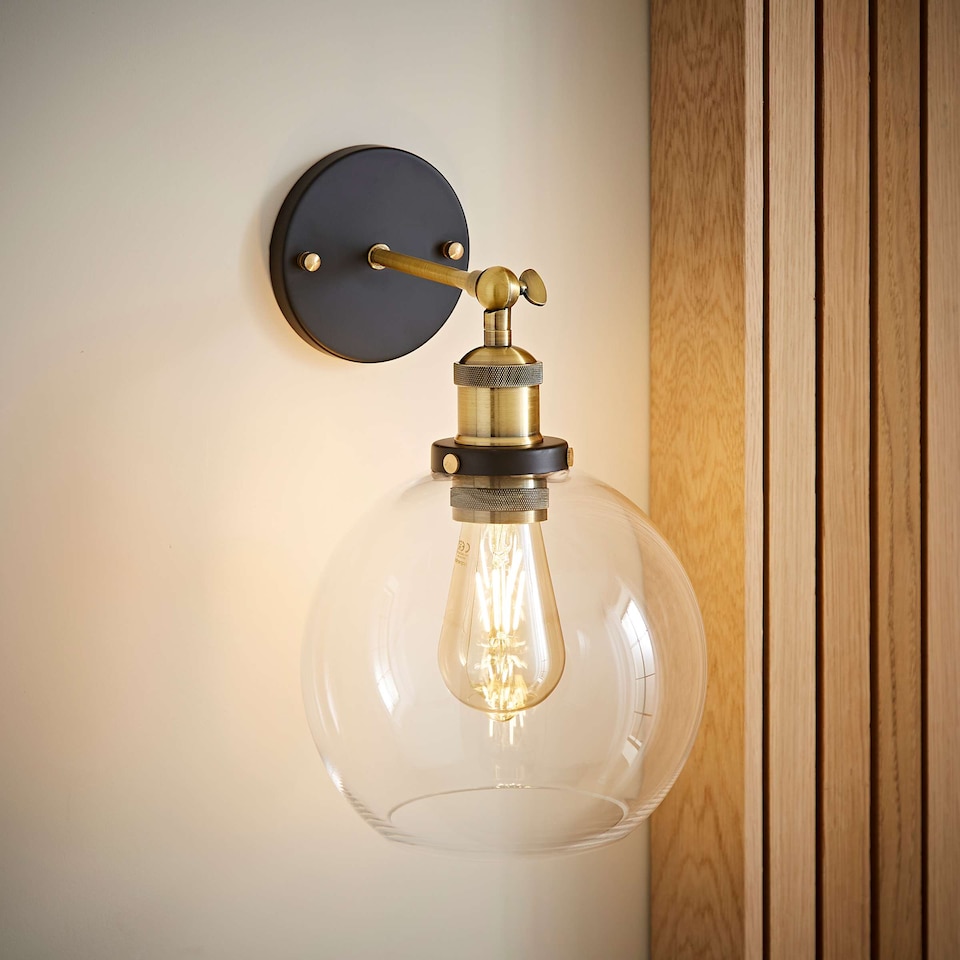 image 1 of ValueLights Sheridan Black and Gold Wall Light Amber Glass Shade