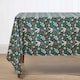 image 1 of Homescapes Festive Forest 100% Cotton Green Christmas Tablecloth - 137 x 137 cm | Green | 137cm x 137cm (54" x 54")