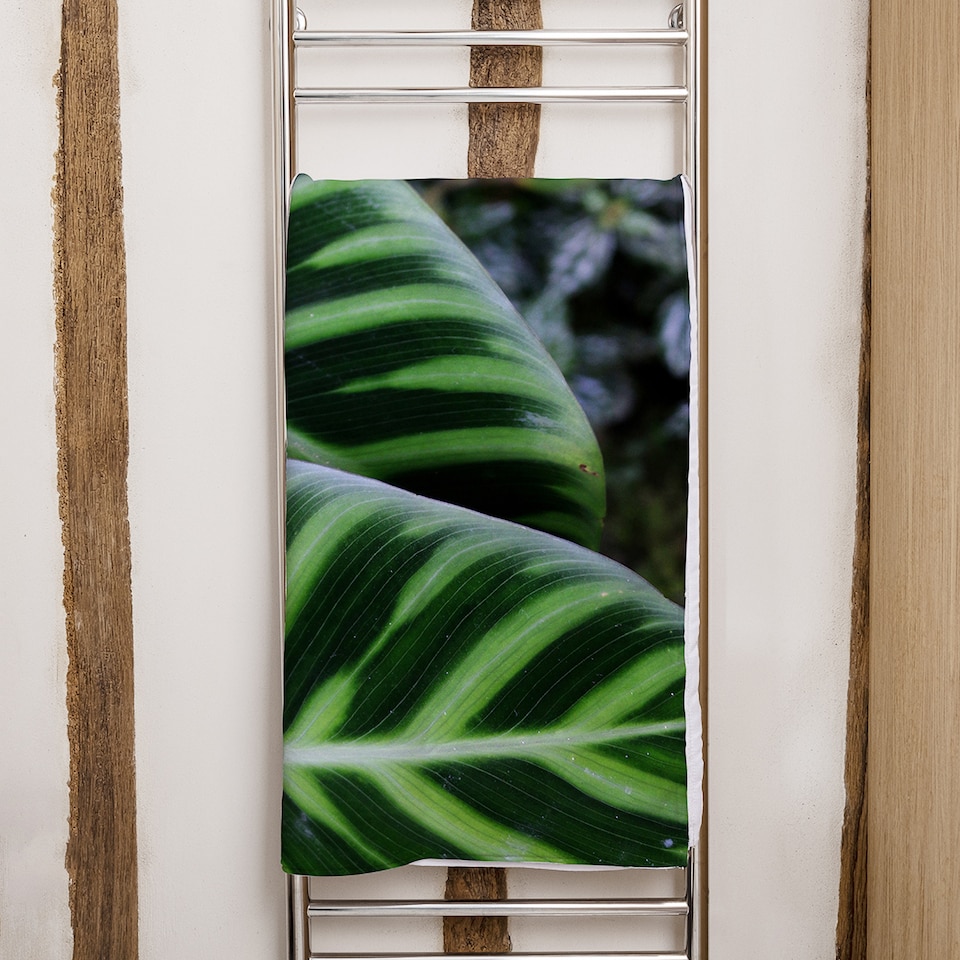 image 1 of yellow structure in exotic jungle setting Designer Bath Towel | Multi