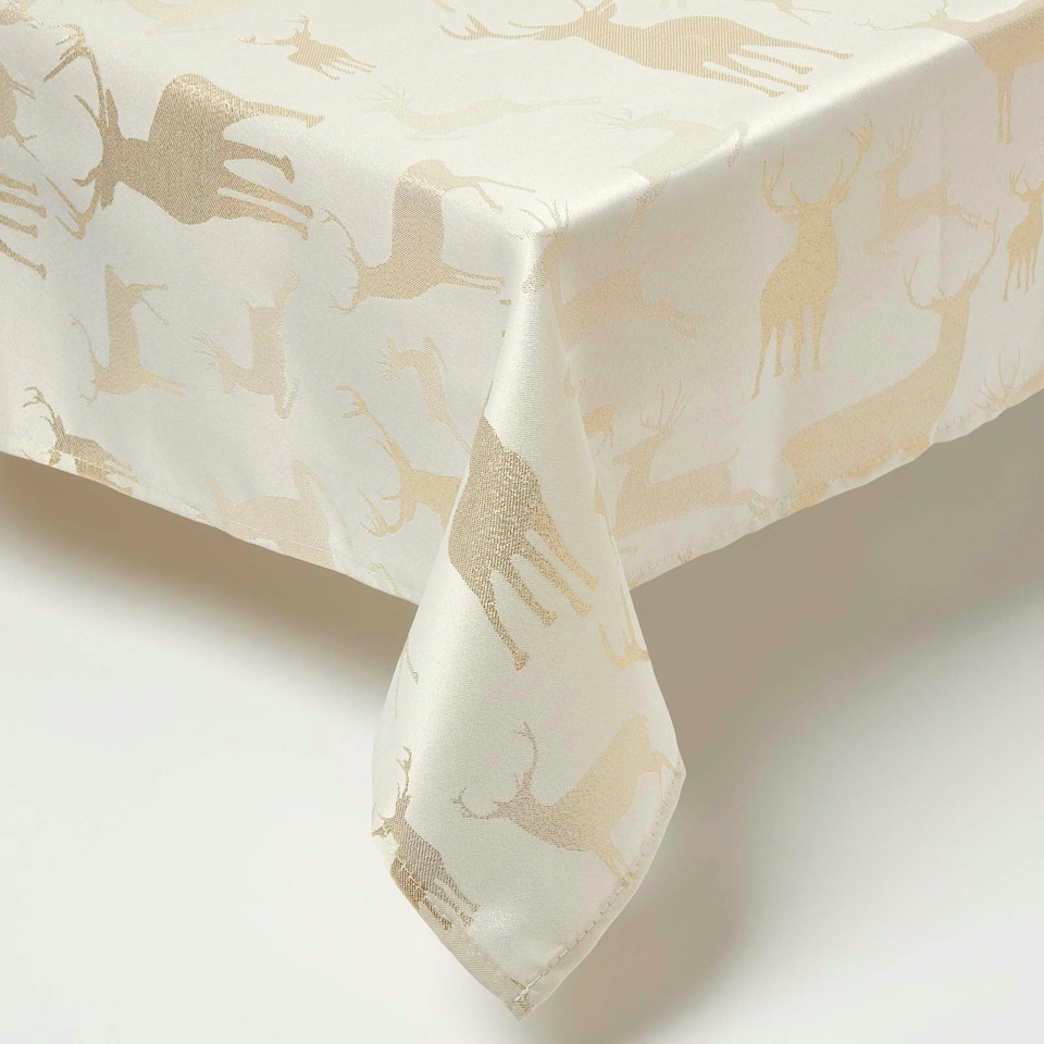 image 1 of Homescapes Gold Stag Christmas Table Cloth - 132 x 228 cm | Gold | 132 x 228 cm