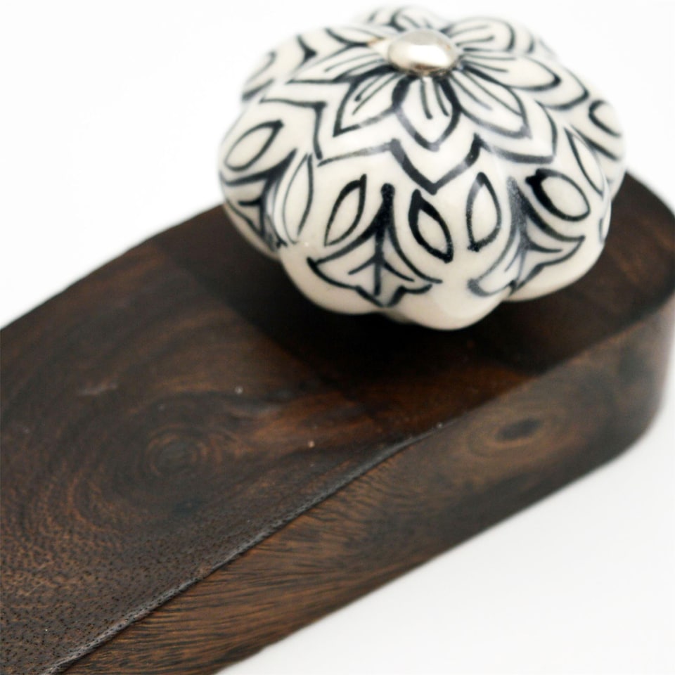 image 1 of Nicola Spring Wooden Door Stop - Black Flower
