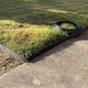 image 2 of Flexible Black Plastic Garden Lawn Edging with 40 Pegs (10m) - 4 Rolls