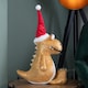 image 4 of 60cm Tall Gold Plush Zilla Dino Sitting Christmas Decoration with Santa Hat