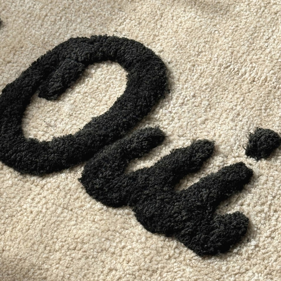 image 1 of Oui Oui Slogan Scalloped Bath Mat