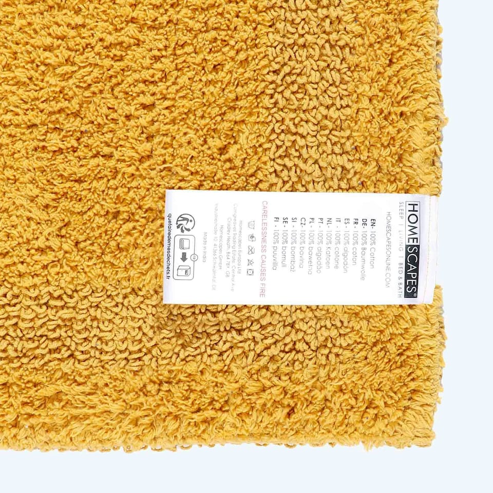 image 1 of Homescapes Luxury Reversible Extra Large Bath Mat - Mustard Yellow Yellow