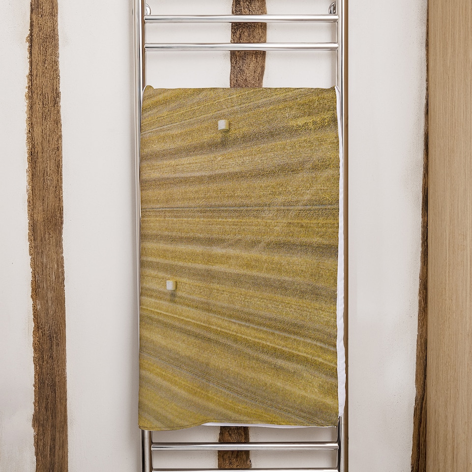 image 1 of straw bales of wheat lying on harvested field Designer Bath Towel | Multi