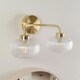 image 3 of ValueLights Amaia Brushed Gold IP44 Rated 2 Way Clear Ribbed Glass Wall Light