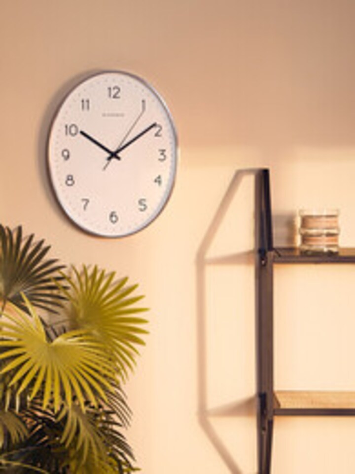 image 1 of Elko Oval Wall Clock with Dark Grey Finish