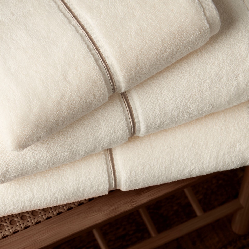 image 1 of Bianca Zero Twist Satin Stitch Cotton Bath Towel | Cream | Bath towel